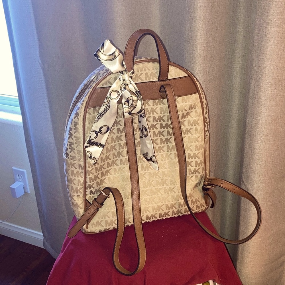 NWOT” Michael Kors Lg Pack Vibrant Gold with brown leather straps,